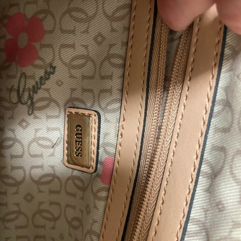 Guess purse cream w black flowers useful but well loved $49